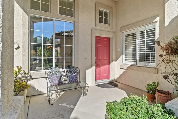 The Front Patio has Direct Access to the Left Side of the Back Yard.