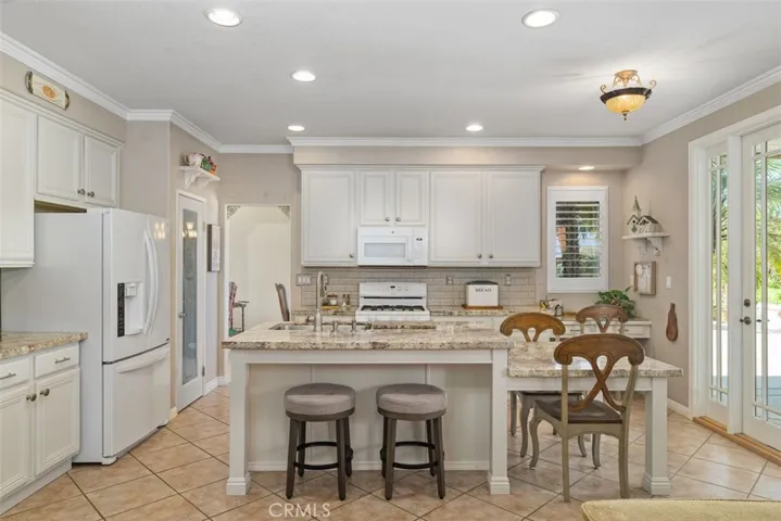 Enjoy a Light, Bright Clean Kitchen with a Walk-in Pantry and Outdoor Access.