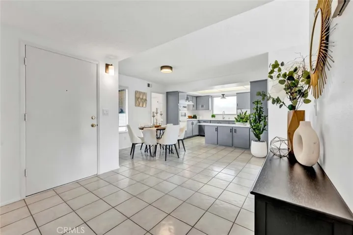 Tile Flooring Flows from Foyer into Dining Room and Kitchen