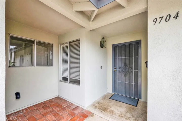 Welcoming Covered Brick Front Porch