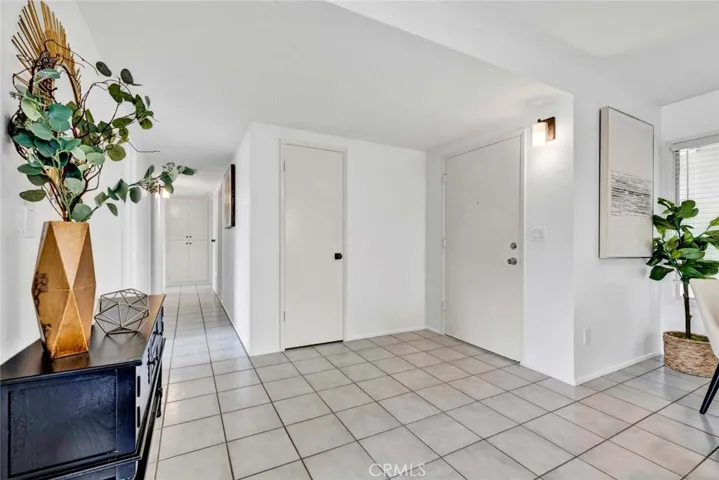 Large Formal Foyer Entry with Tile Flooring
