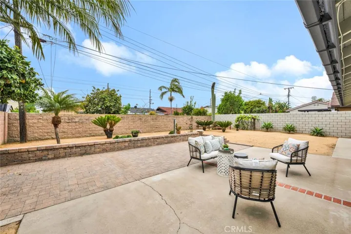 Huge Backyard with Block Wall Fencing and Extra Large Brick-Accented Patio