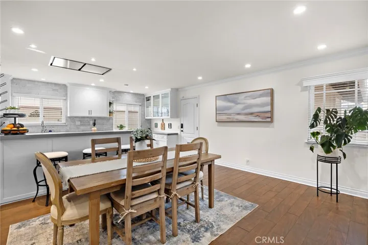 Beautiful wood-look wide plank tile flooring, bullnose corners, high baseboards, and custom crown molding throughout.