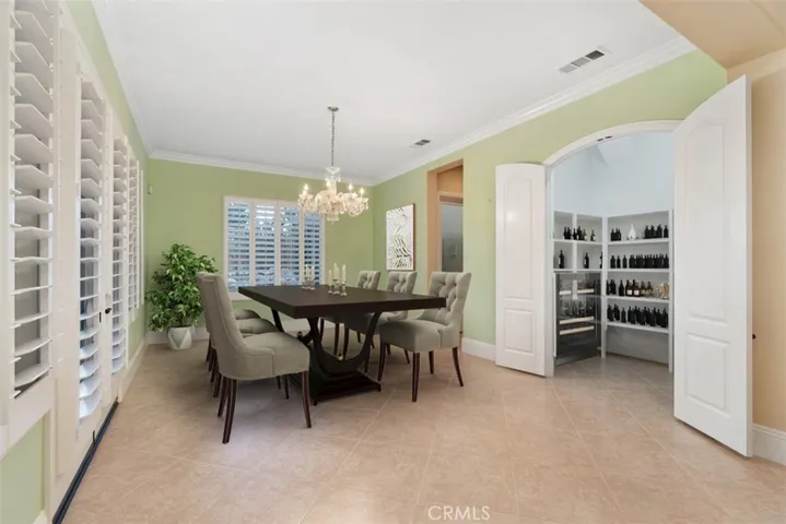 Formal dining room with wine closet.