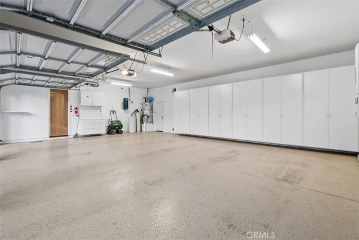 Oversized 3 car garage with cabinets.