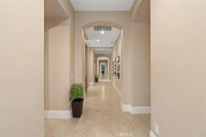 Hallway with tall ceilings and 8" inch kickboards.
