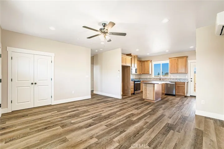MODEL HOME PHOTOS - Actual flooring color is a little lighter and island top is granite