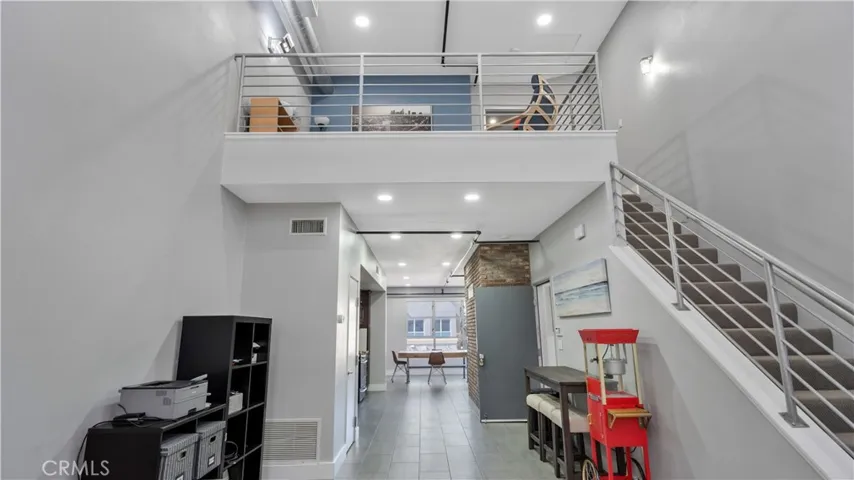 Living room opens to kitchen and dining area.