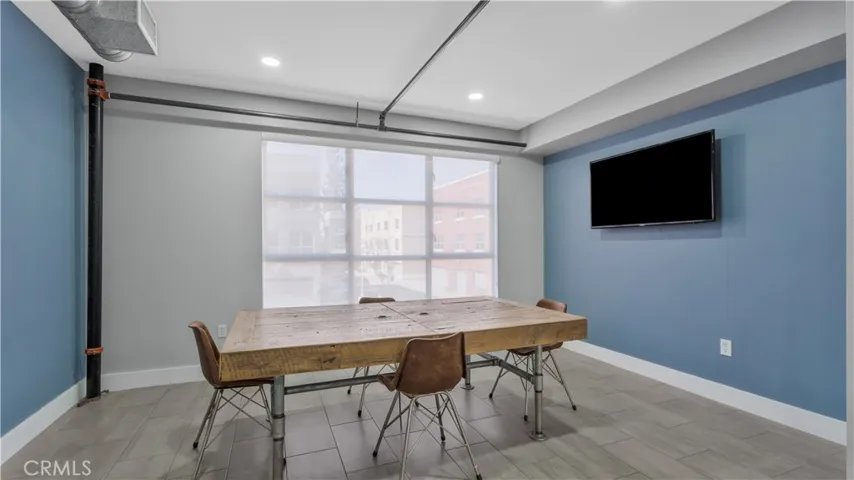 Large dining area with TV mounted.