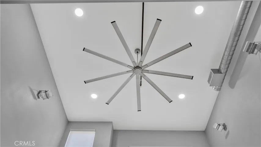 Industrial ceiling fan above the living room.