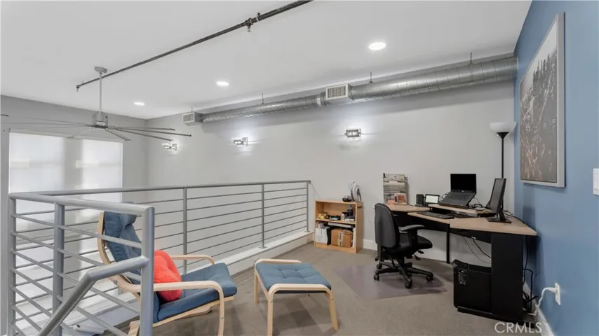 Third floor loft area that over looks living room.
