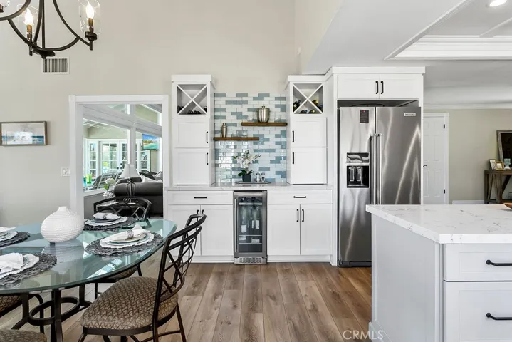 Beverage station with dual appliance garages, fridge and ample storage