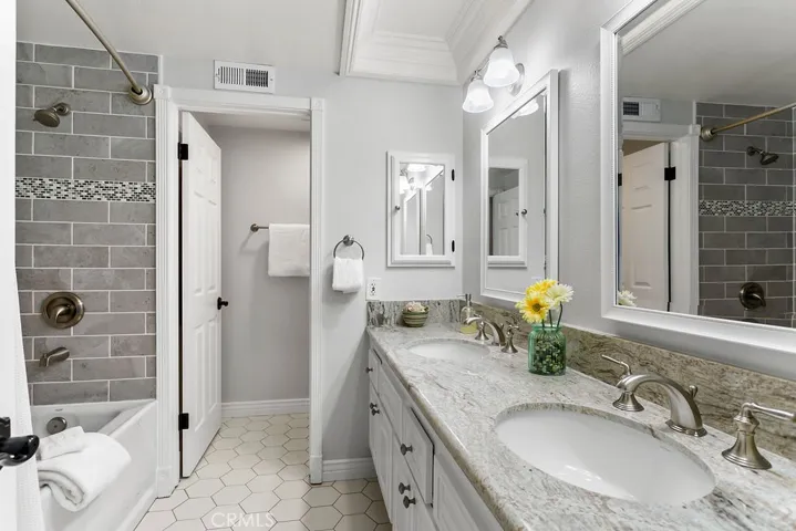 Updated dual vanity hall bathroom