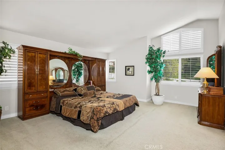 The primary bedroom is a nice room space and offers really great windows with Plantation Shutters!