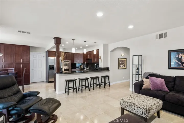 Family room is open concept with the kitchen. Nice breakfast bar for hanging out or doing homework.
