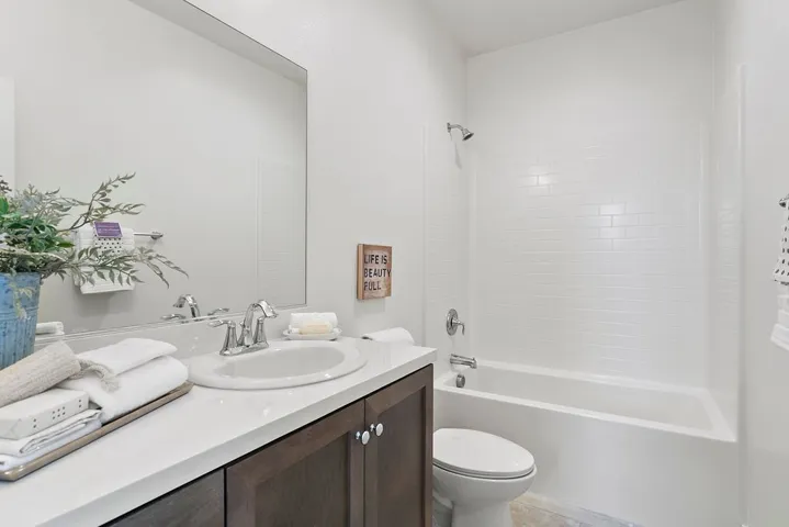 Upstairs bathroom with shower over generous bathtub like new!