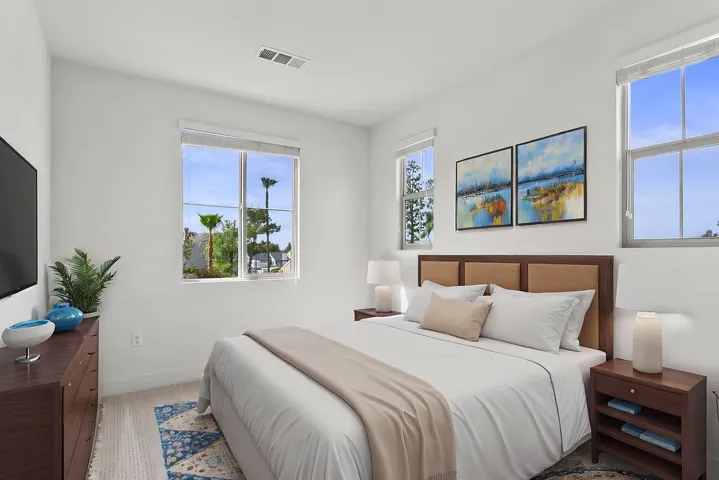 Light filled second level bedroom virtually staged