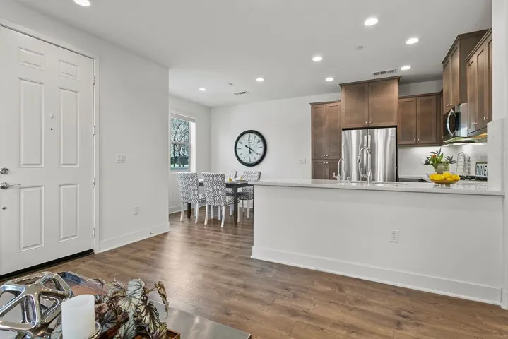 Kitchen and dining areas open to family room