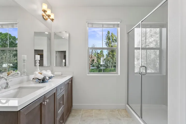 Primary bathroom with oversize walk in shower and dual sink vanity