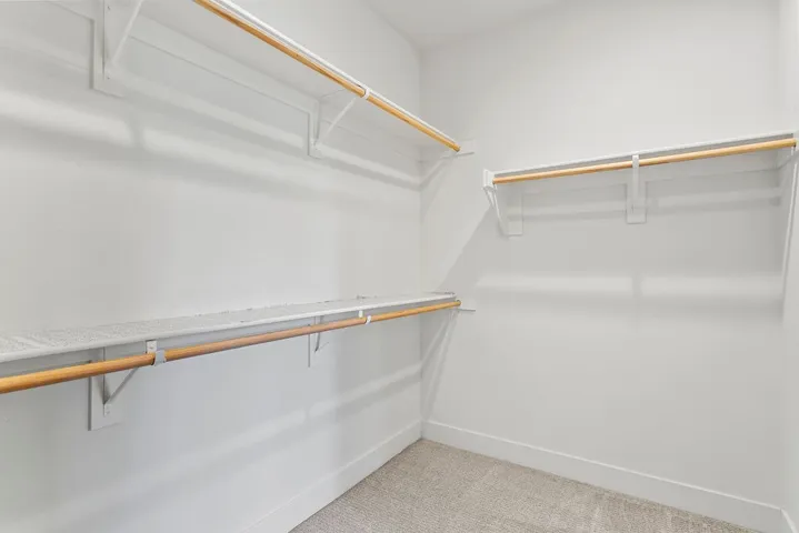 Walk in closet in primary almost the size of a bedroom