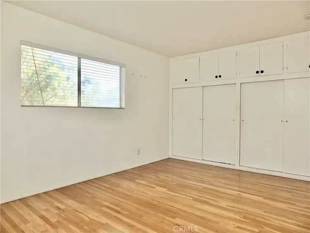 Main bedroom with hardwood flooring