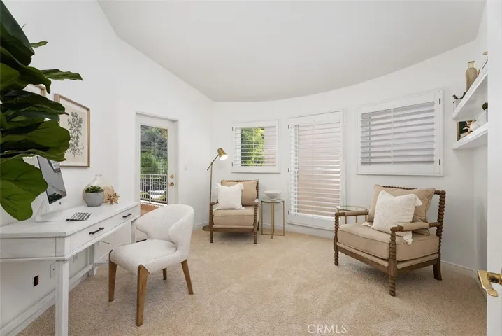 Den or family room with access to the balcony