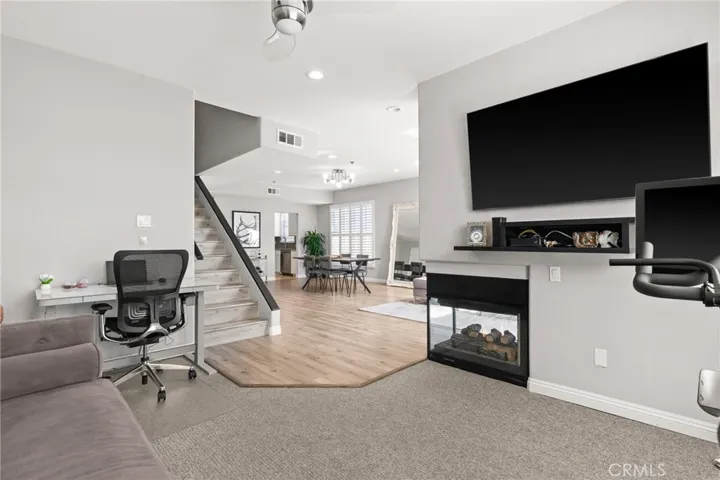 Den/Office with double sided gas fireplace.