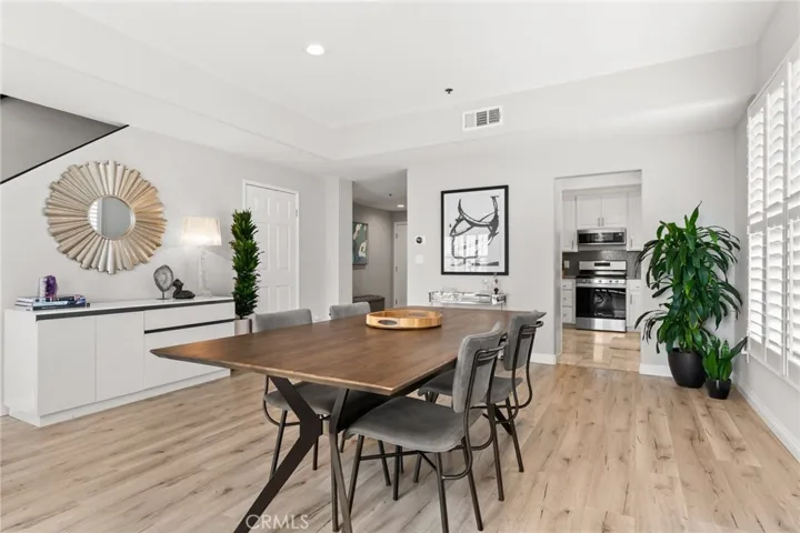 Dining area leading towards kitchen.
