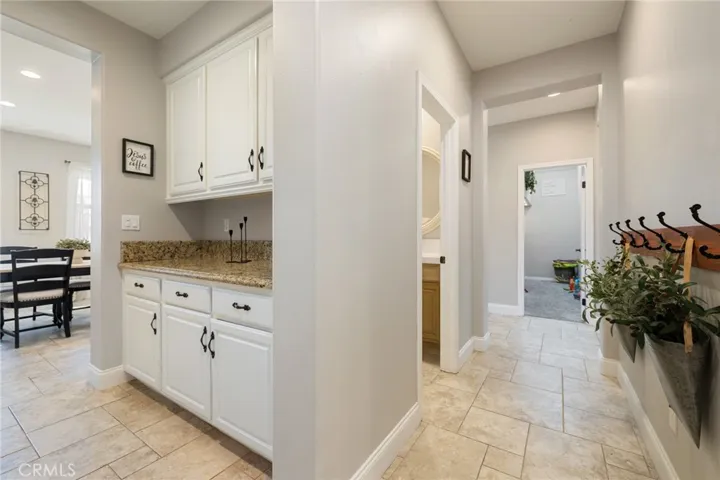 Butler's pantry and to the right, access to the half bath