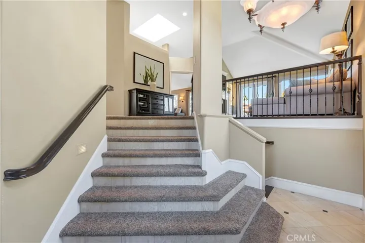 Grand formal entry welcomes you home with an inviting angular staircase