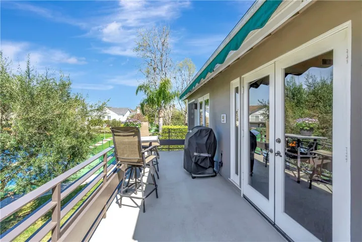Delightful balcony with an automatic awning off the upstairs living and family rooms
