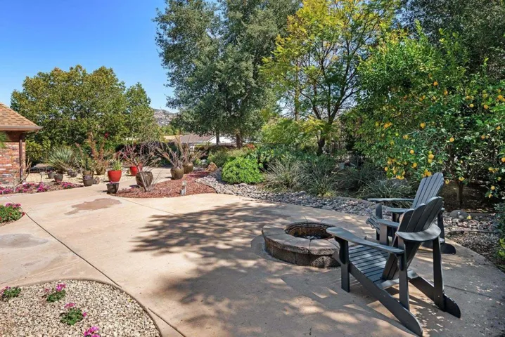 A sunken fire pit highlights the front courtyard