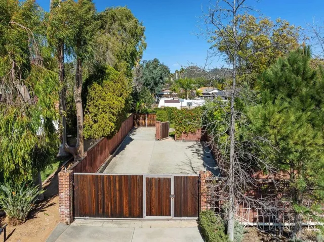Here you can see the pedestrian door (in the middle of the rolling gate) from outside the property.