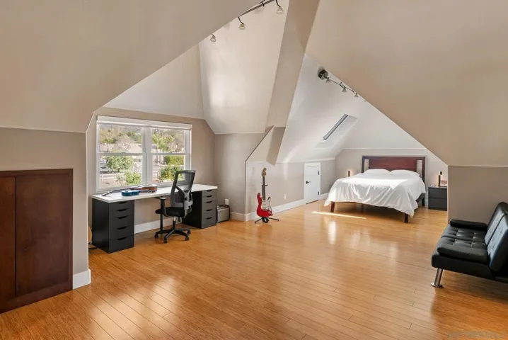 This bedroom is 28ft long and 16ft at the widest point.  It has its own walk-in closet, large luxurious bathroom, 2 remote controlled skylights, and lots of storage space.