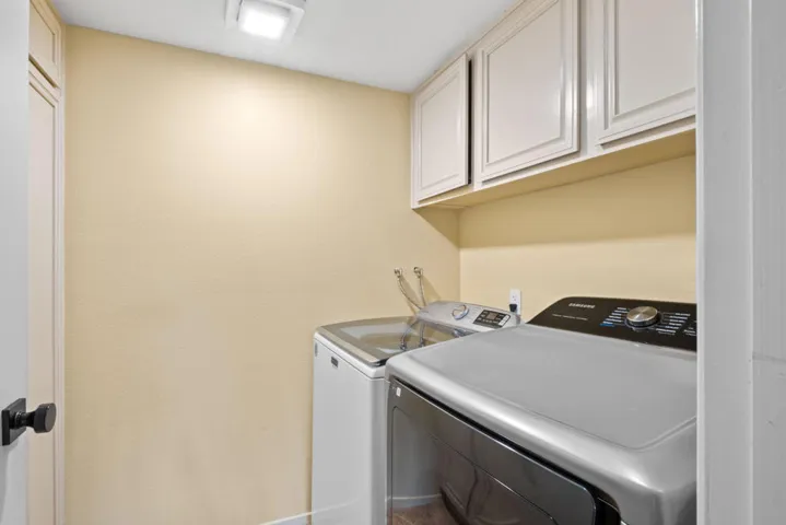 Layndry Room with lots of closets
