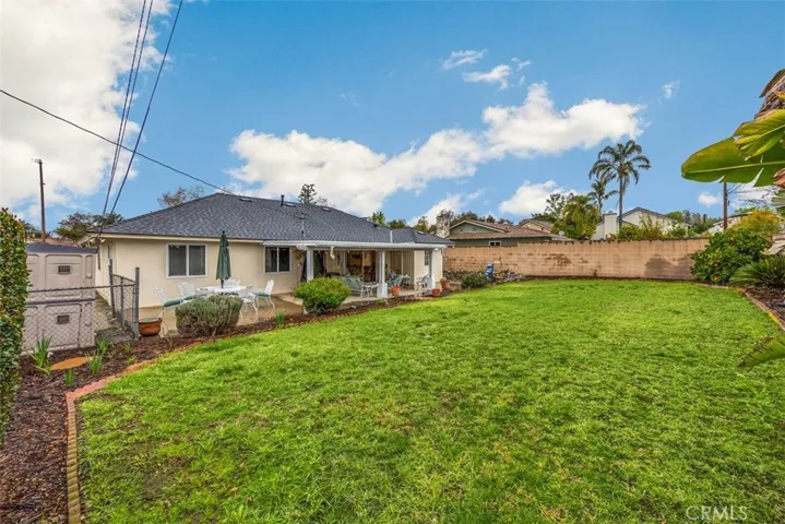 Fenced in Dog Run & Storage Shed on the Right