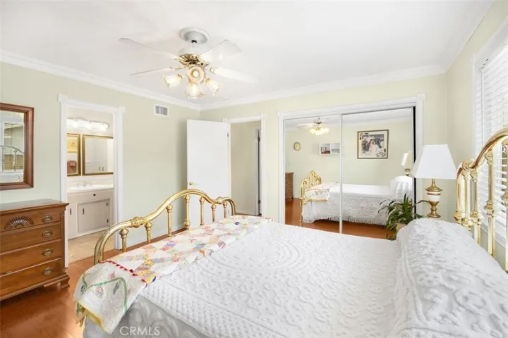 Primary Bedroom with Mirrored Closet Doors