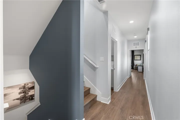 Upgraded vinyl plank wood flooring throughout including stairs