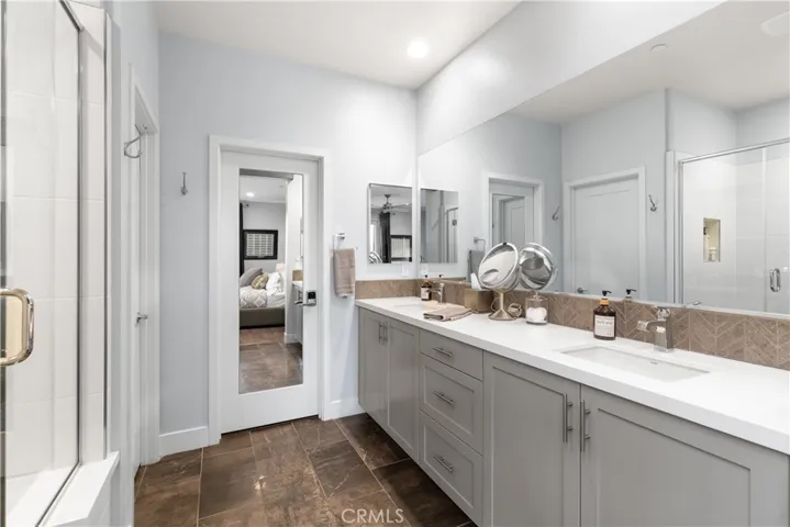 primary ensuite bathroom with walk-in closet