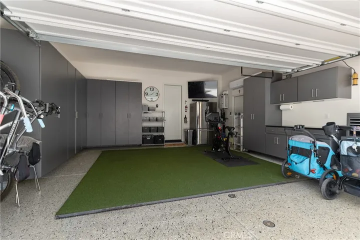Garage with epoxy flooring & ample storage
