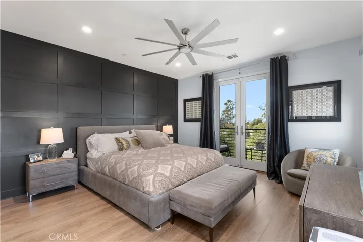 Primary ensuite bedroom with a decorative wall finish