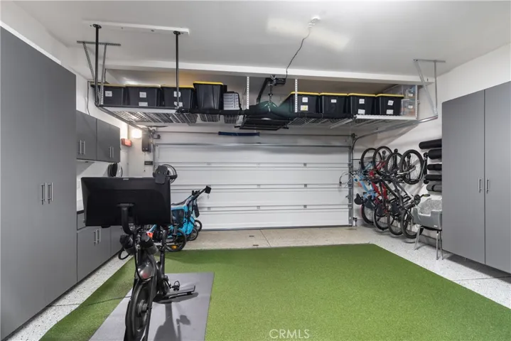 Garage with epoxy flooring & ample storage