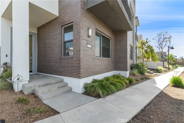This property features a modern architectural design, well-maintained landscaped grounds, corner location