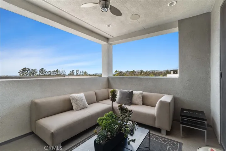 Third story loft features an outdoor patio area with built-in outdoor speakers, a TV, and breathtaking views