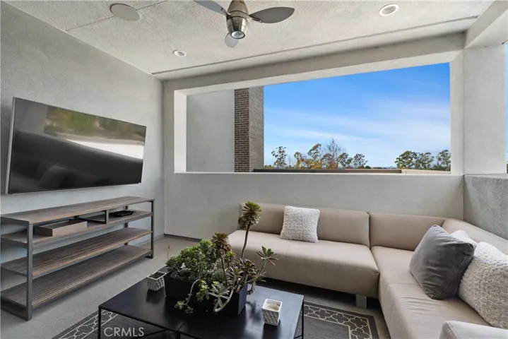 Third story loft features an outdoor patio area with built-in outdoor speakers, a TV, and breathtaking views