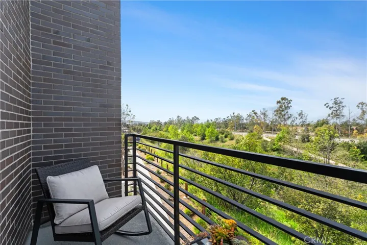 The primary ensuite bedroom offers its own private balcony with scenic vistas