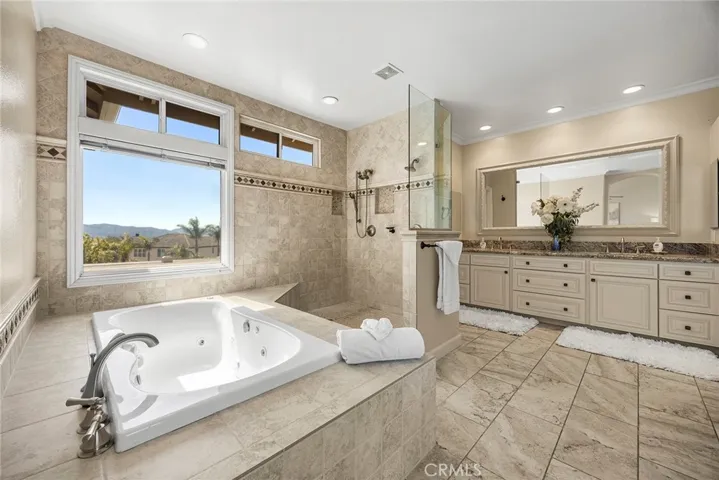 Elegant Primary bath with oversized walk-in Closets.