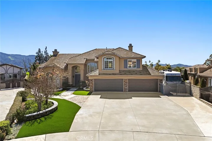 Beautiful curb appeal with 4 car garage & RV parking