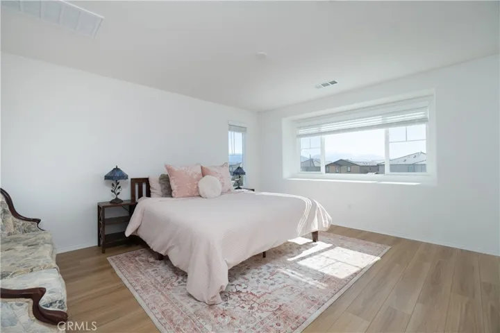 Spacious primary suite with extra wide window ledge