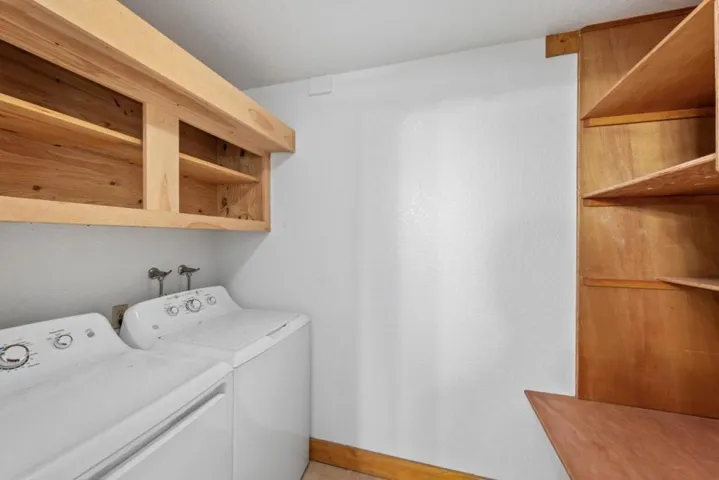 Attached to bathroom, laundry room has extra storage